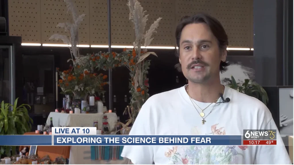 Luminarium team member Brenton featured in a news clip. Text overlay reads: Live at 10, experience the science behind fear